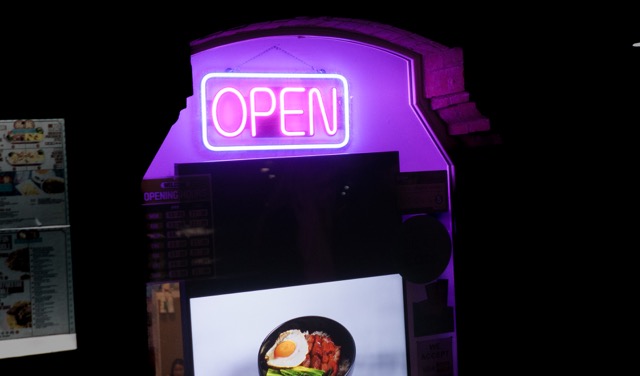 A neon sign from Manchester china town to show how to contact your wedding photographer Adam Edwards