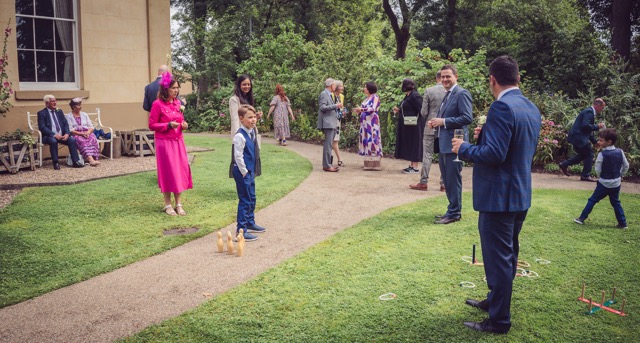 Wedding guests at Elizabeth Gaskell's House in Manchester by photographer Adam Edwards